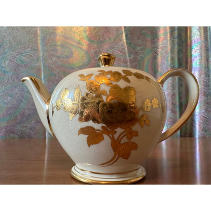 Vintage single serve Sadler teapot with gold flowers and trim
